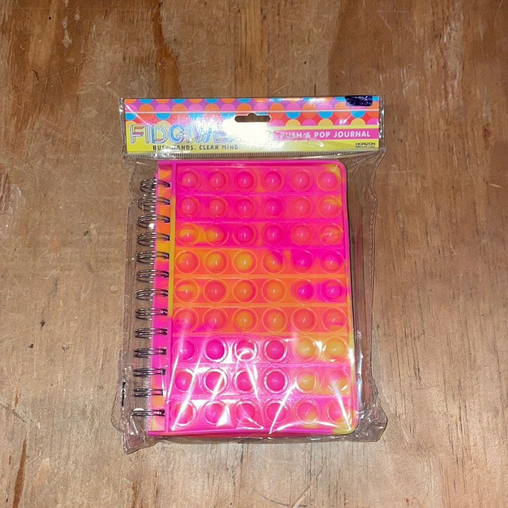 NIP FIDGET PUSH AND POP JOURNAL. PINK. GREAT FOR BACK TO SCHOOL!
